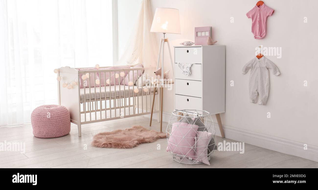 Baby room interior with comfortable crib. Banner design Stock Photo - Alamy