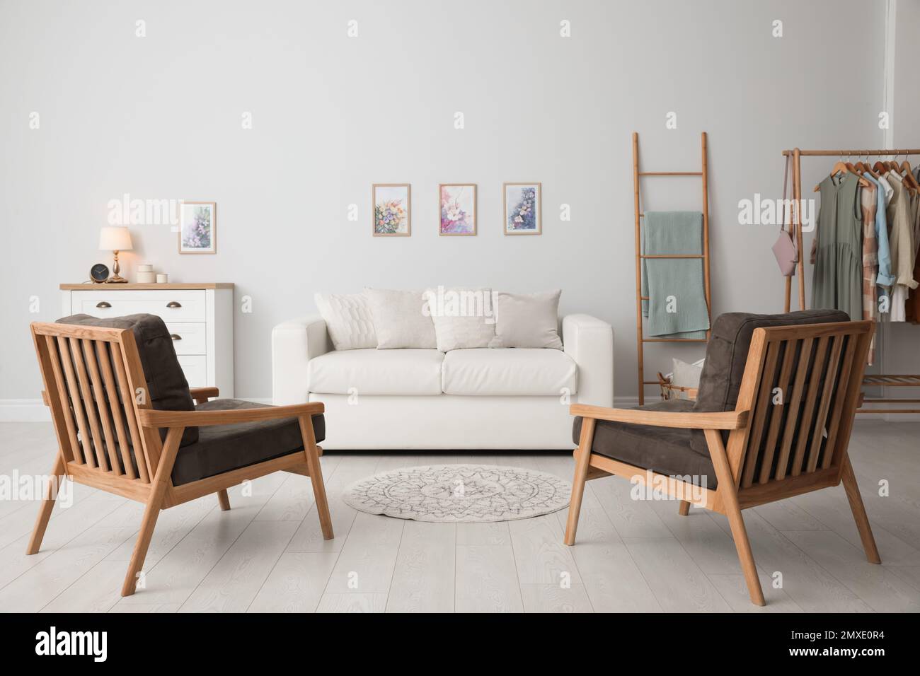 Modern living room interior with comfortable sofa and armchairs Stock ...