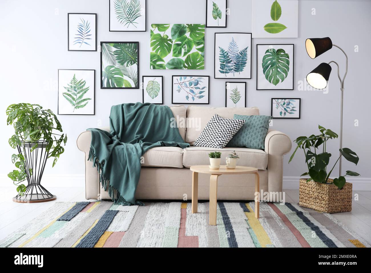 Photo inspiration: Beautiful Artworks And Comfortable Couch In Stylish Room Interior Photo Inspiration
