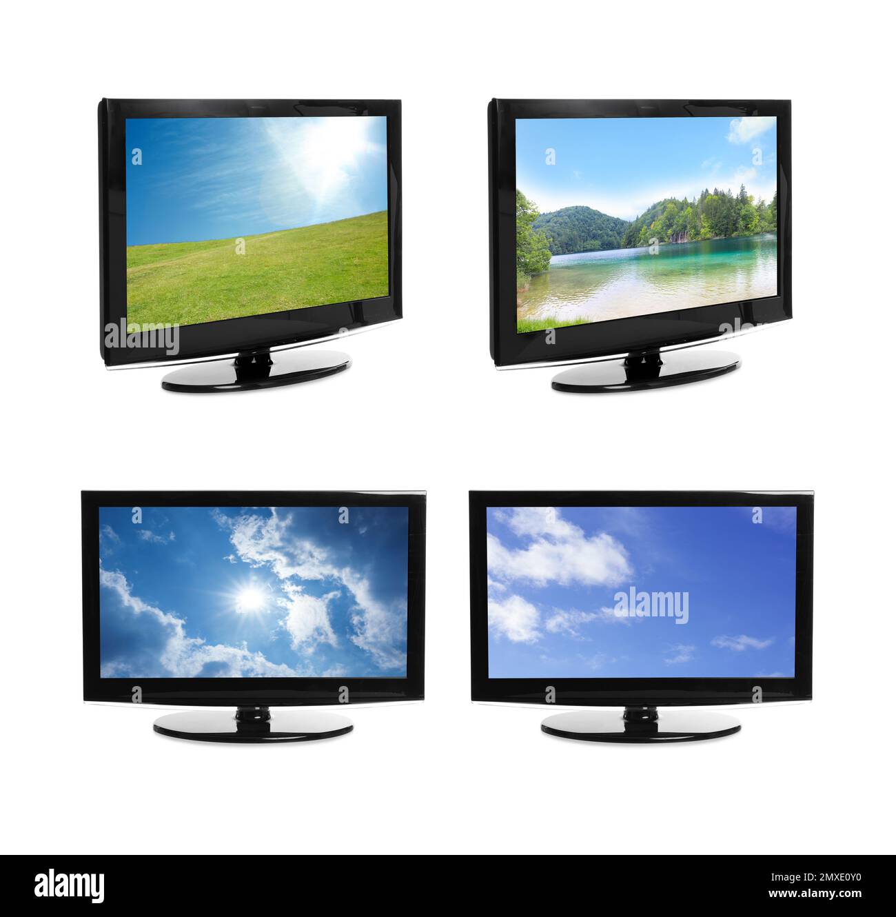 Set of modern plasma TVs with landscape on screens against white background Stock Photo