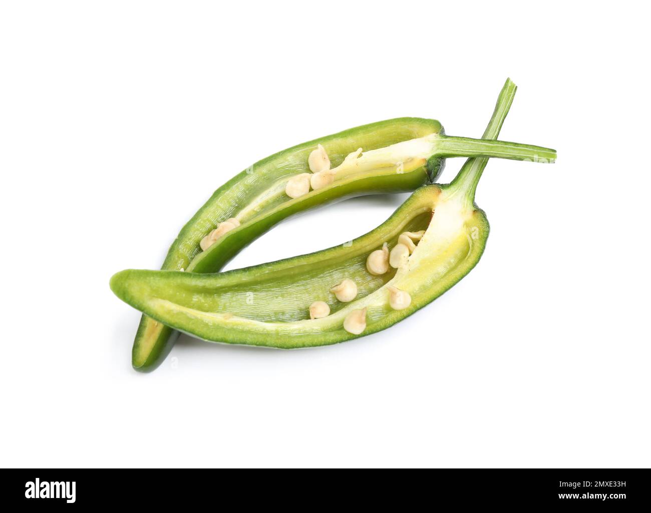 Cut green hot chili pepper on white background Stock Photo - Alamy