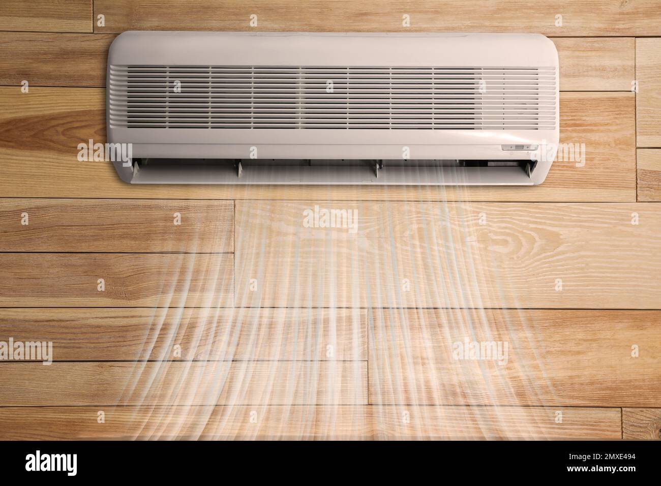 Modern air conditioner on wooden wall indoors Stock Photo Alamy
