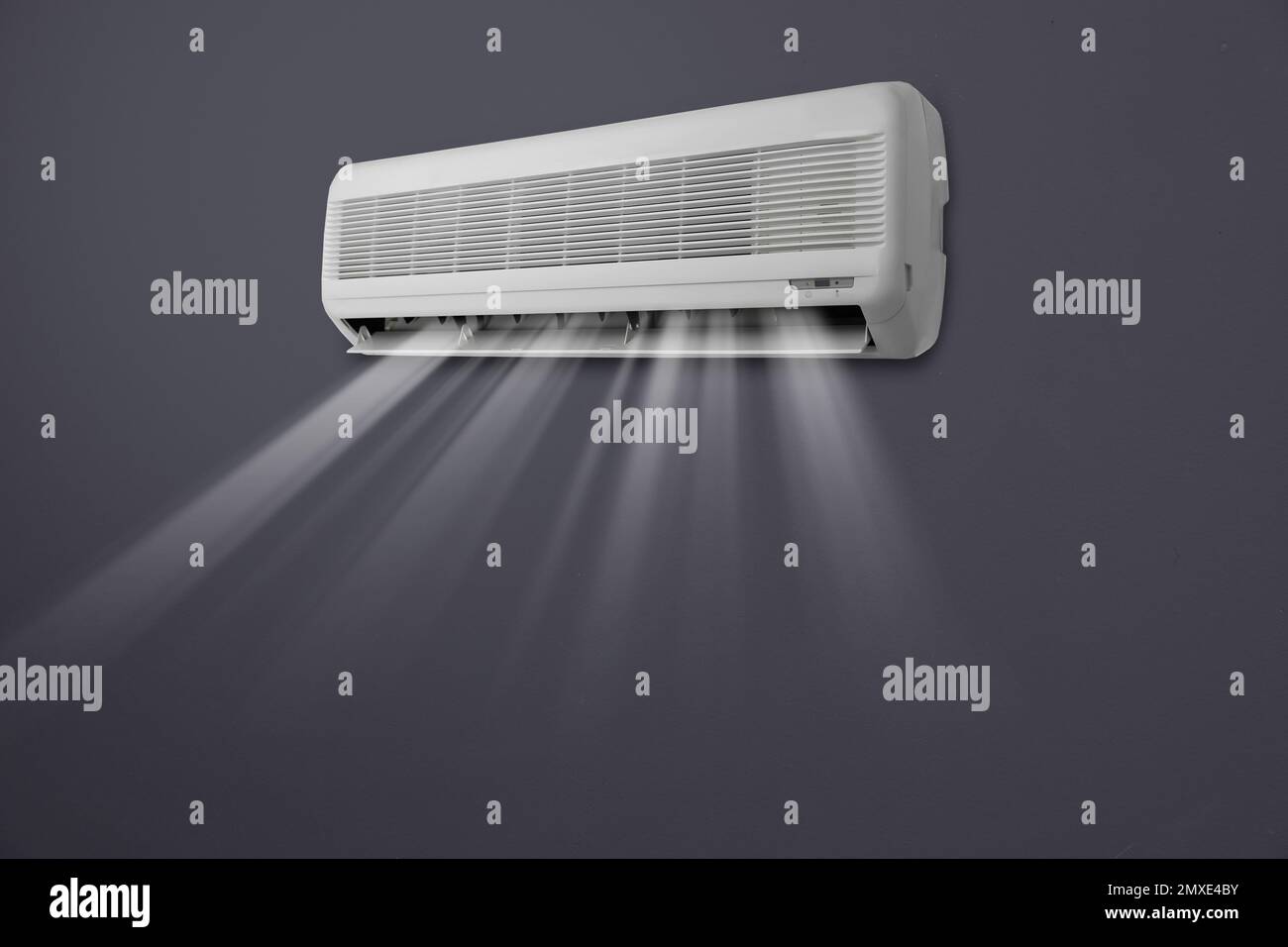 Modern air conditioner on black wall indoors Stock Photo Alamy