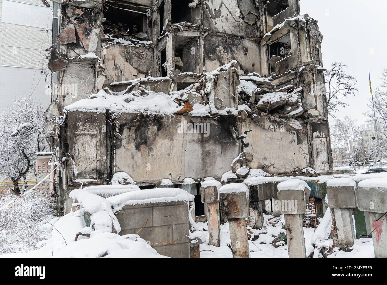 Wall of a destroyed building with Banksy graffiti in Borodyanka, Ukraine Stock Photo