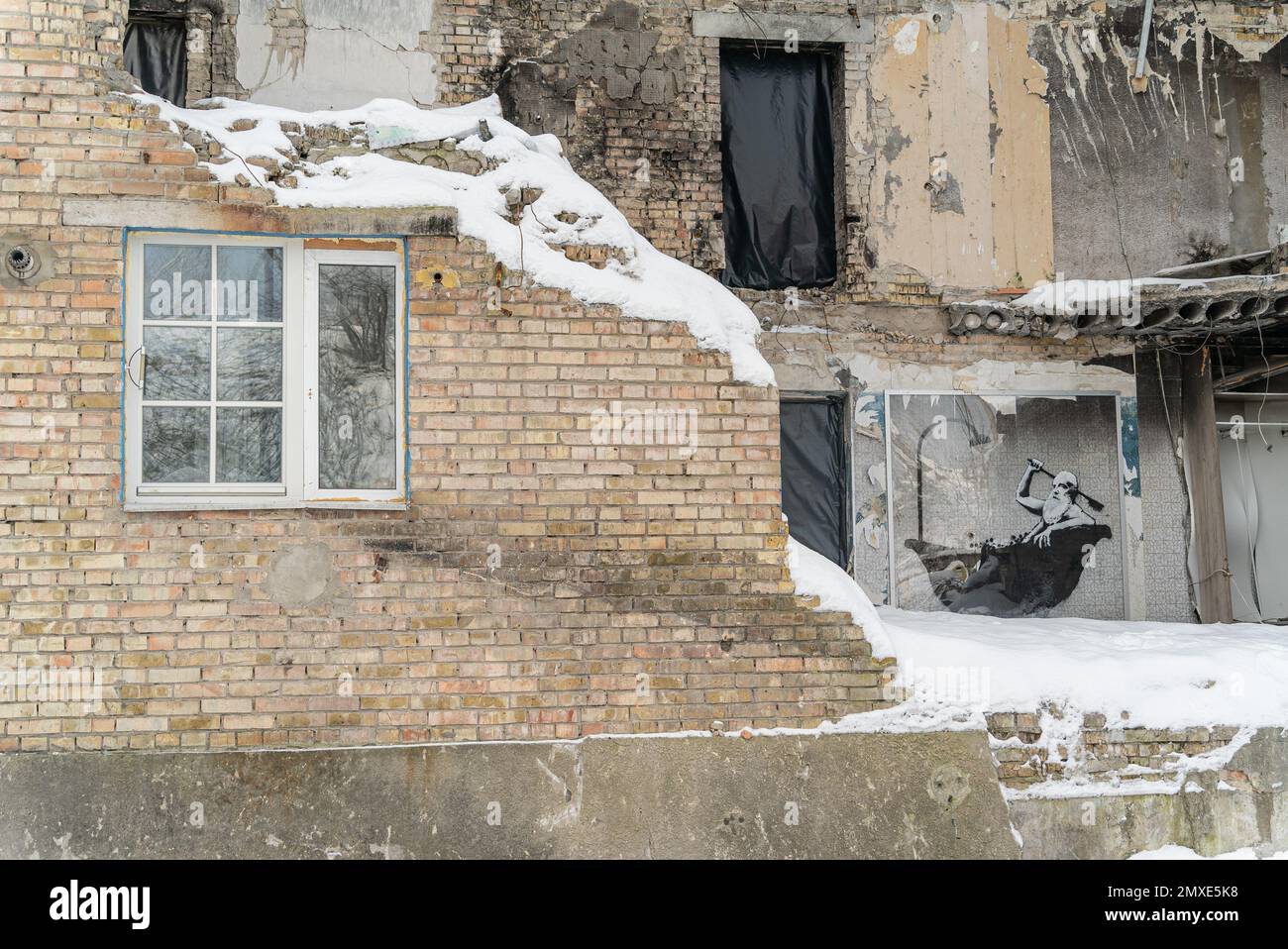 Gorenka, Ukraine - Banksy graffiti in a bombed-out house Stock Photo