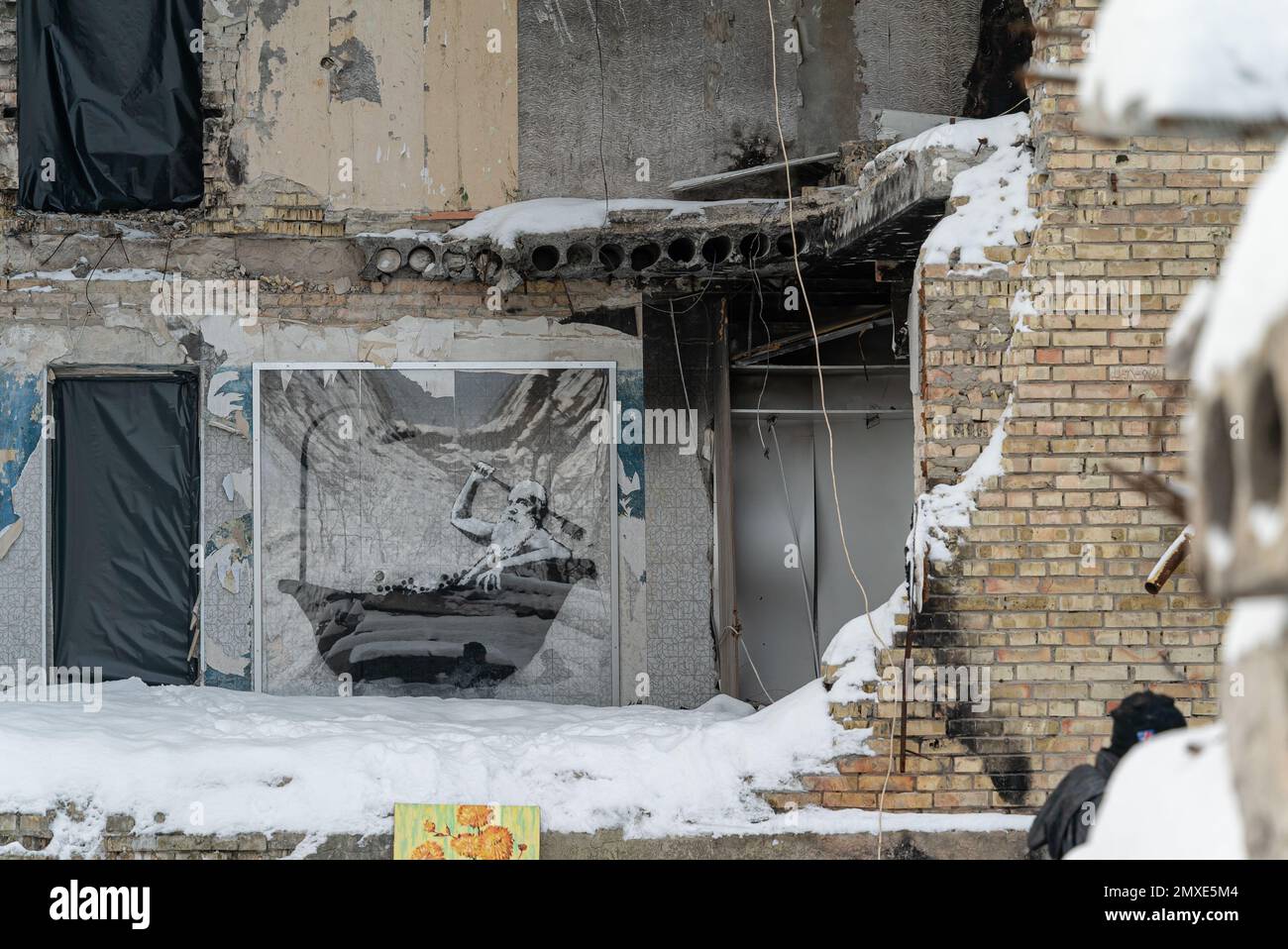 War-torn house with Banksy graffiti in Gorenka, Ukraine Stock Photo