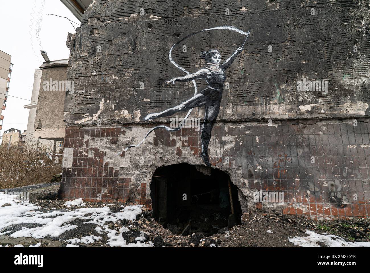 IRPIN, UKRAINE - NOVEMBER 29, 2022: Graffiti by Banksy on a destroyed house in Irpin, Ukraine Stock Photo
