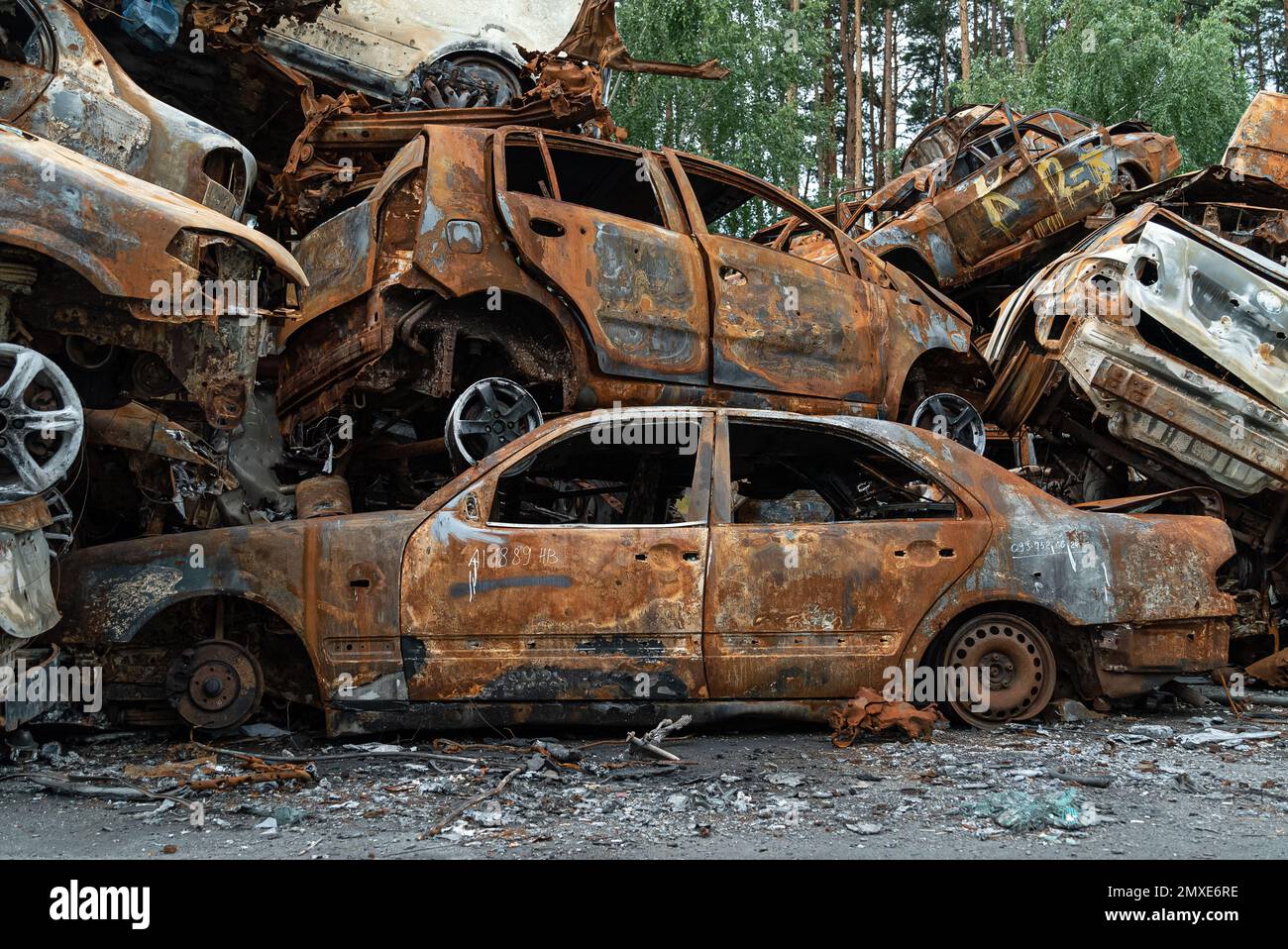 War in Ukraine: a dump of shot and burned cars in Irpin, Bucha district Stock Photo