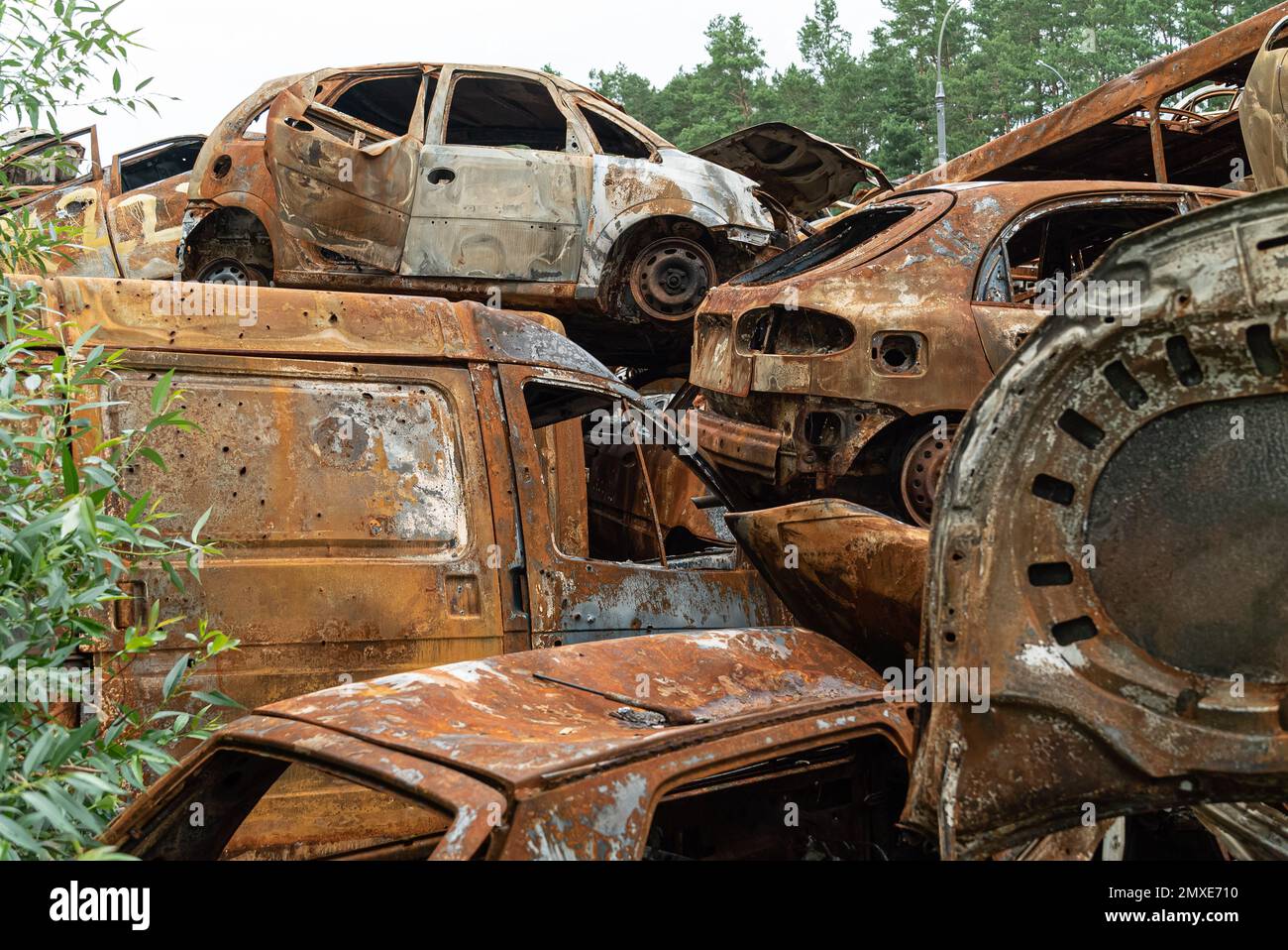 War in Ukraine: a dump of shot and burned cars in Irpin, Bucha district Stock Photo