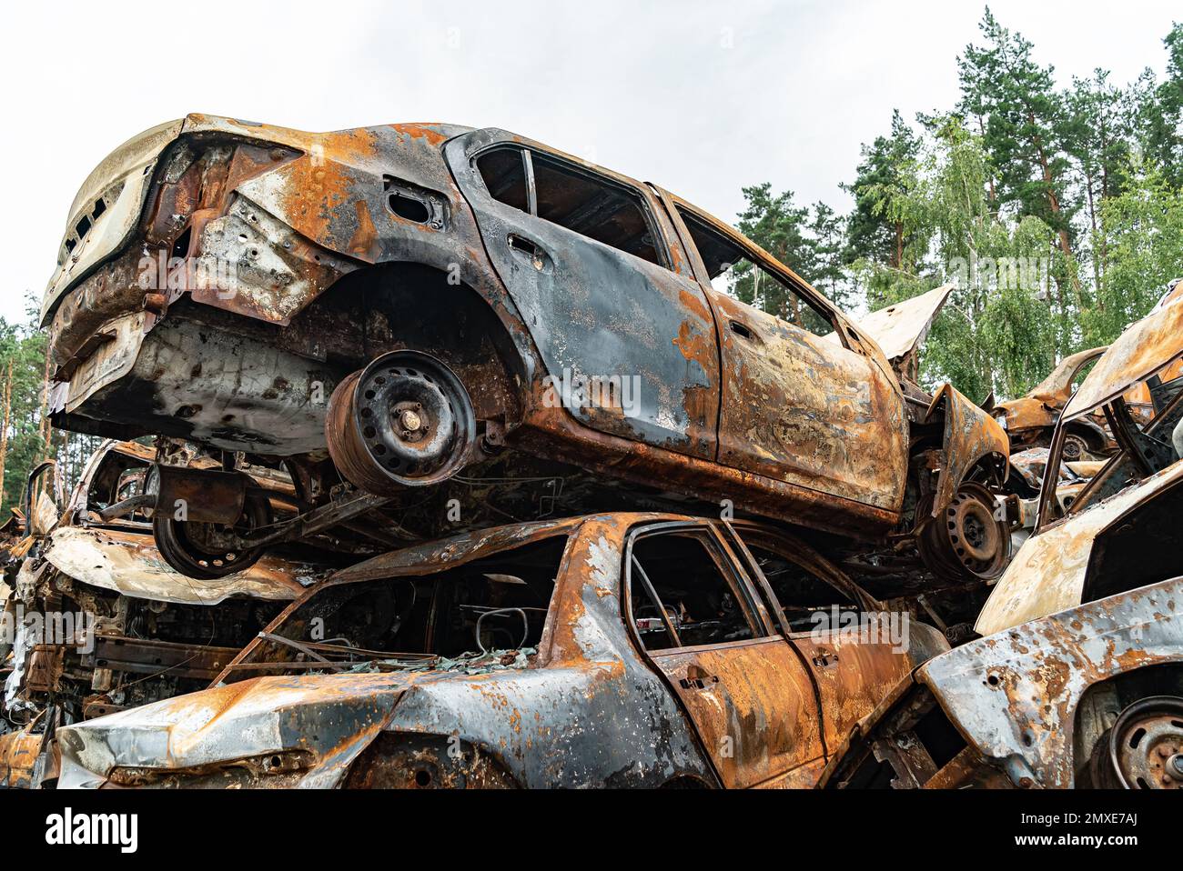 Consequences of the war in Ukraine - destroyed cars in Irpin, Bucha district. Stock Photo