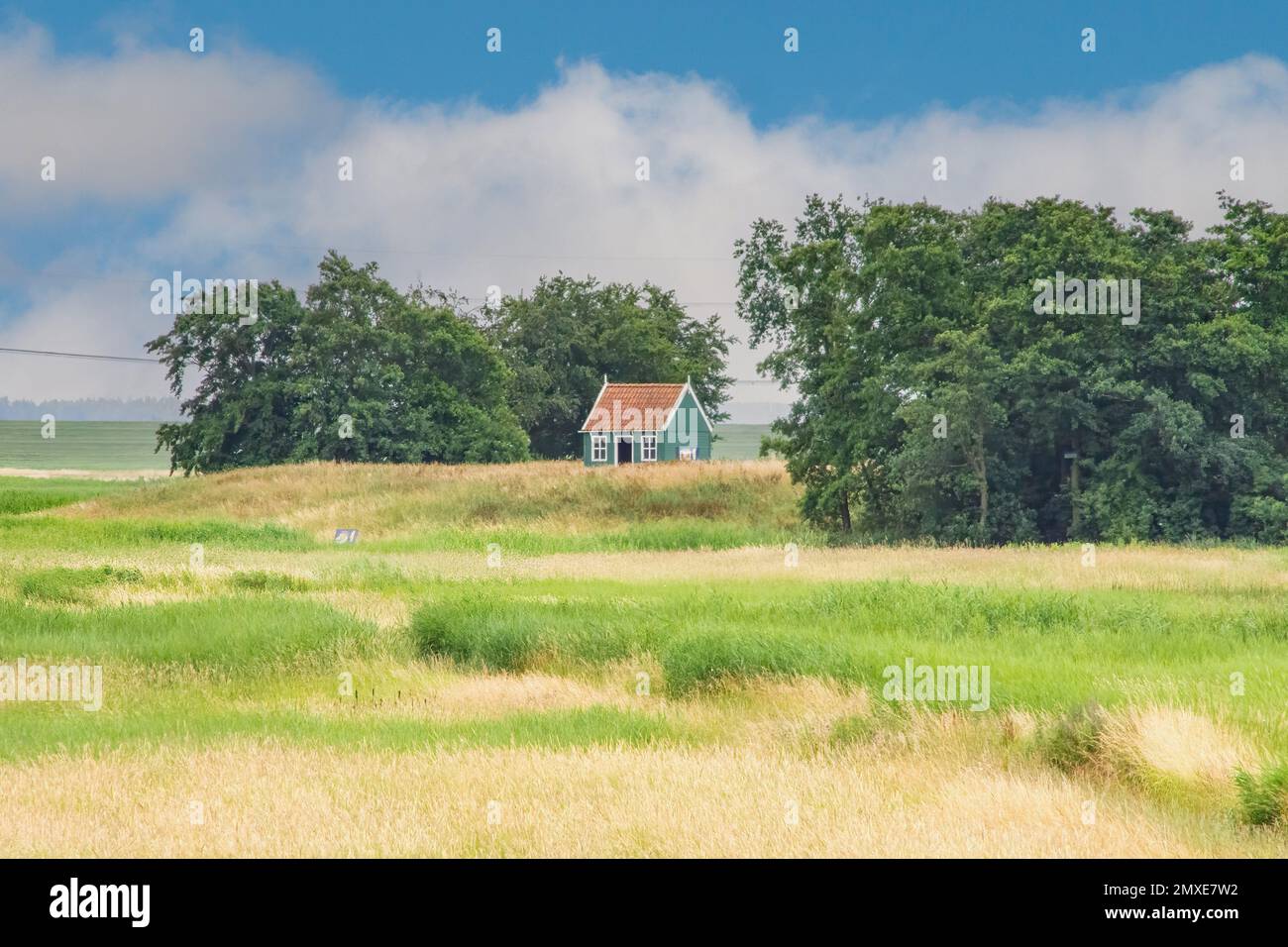 A small country house in a rural field Stock Photo - Alamy