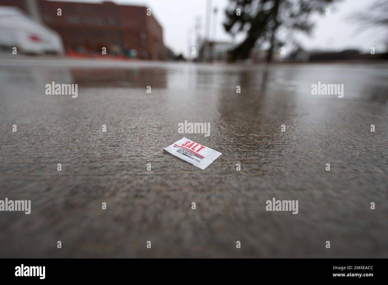 Salt on an icy sidewalk Stock Photo Alamy