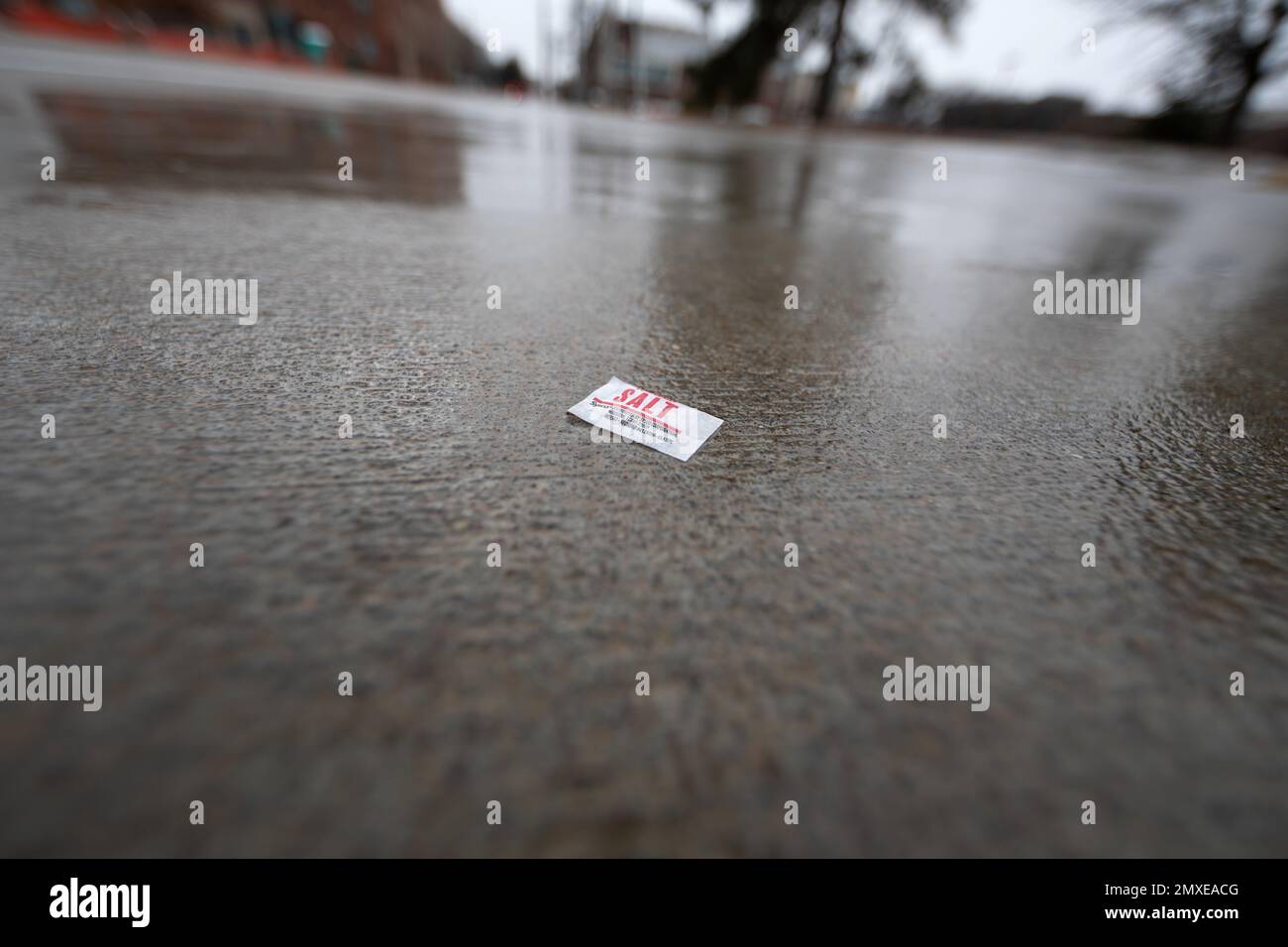 Salt on an icy sidewalk Stock Photo Alamy