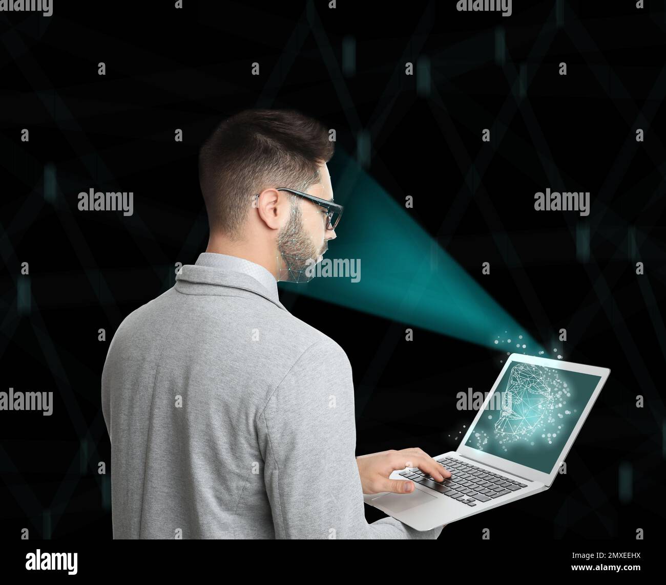 Facial recognition system. Man using laptop on color background Stock Photo