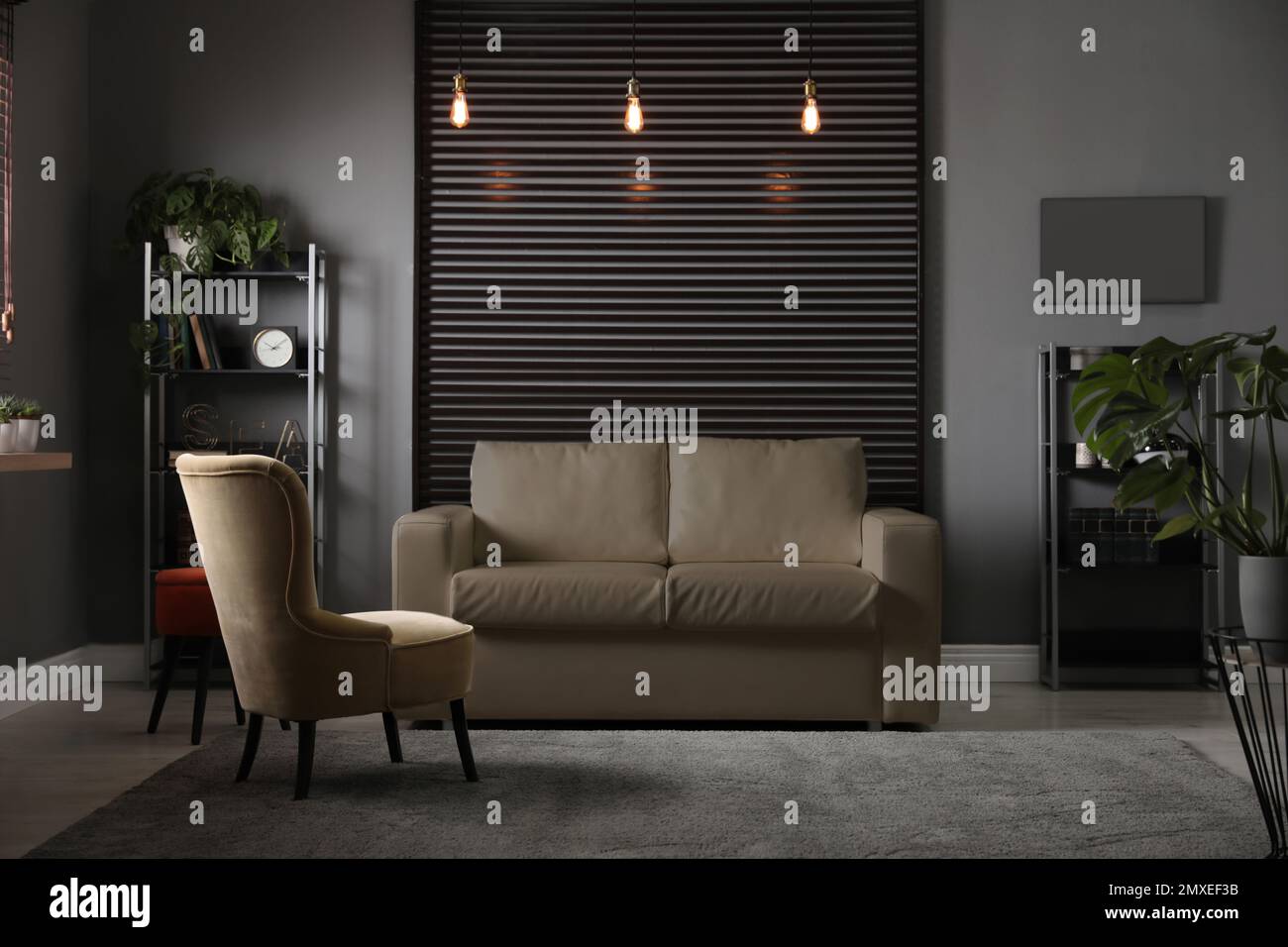 Stylish living room interior with elegant leather sofa Stock Photo - Alamy