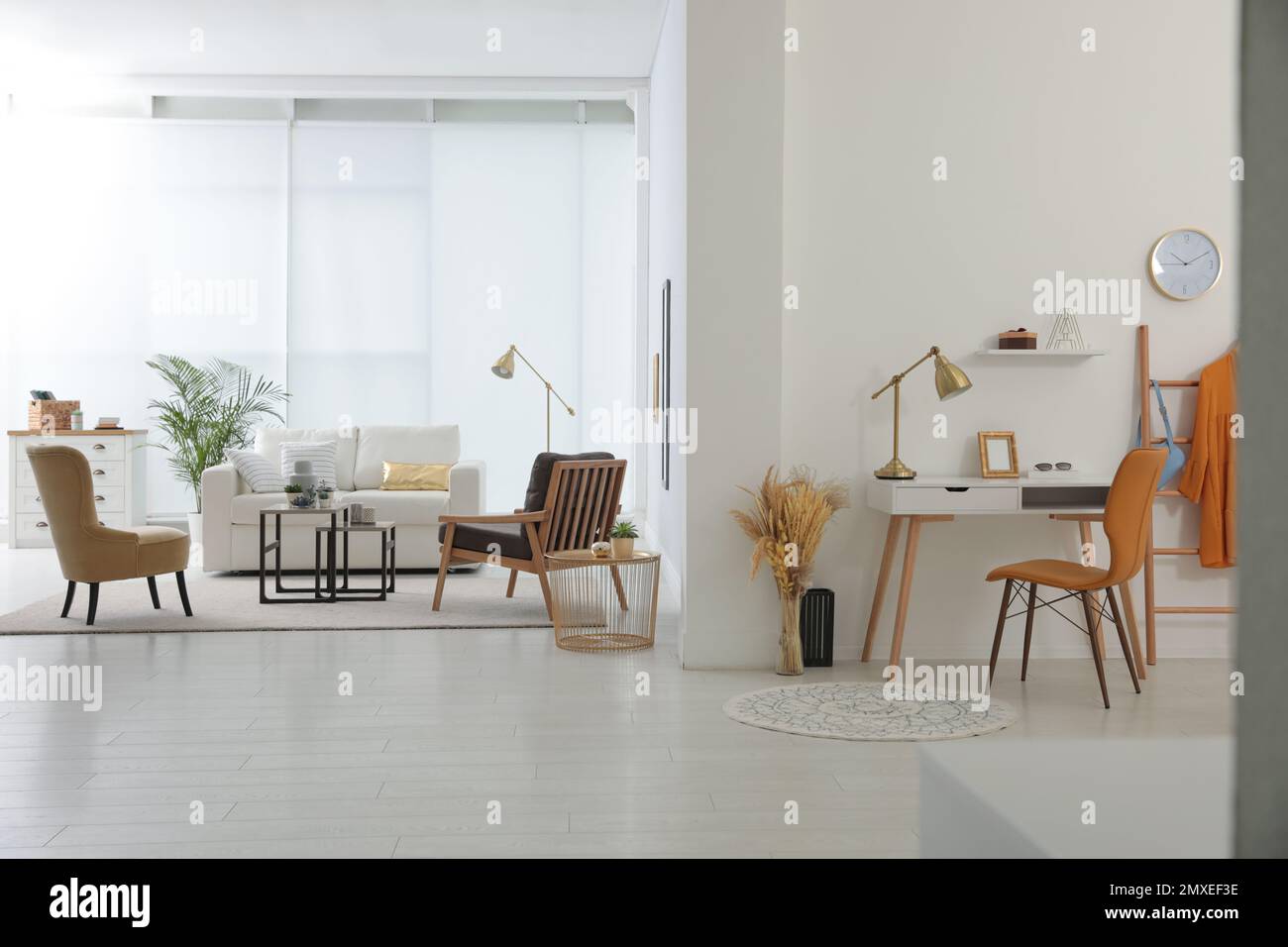 Living room and workplace in spacious apartment. Interior design Stock ...