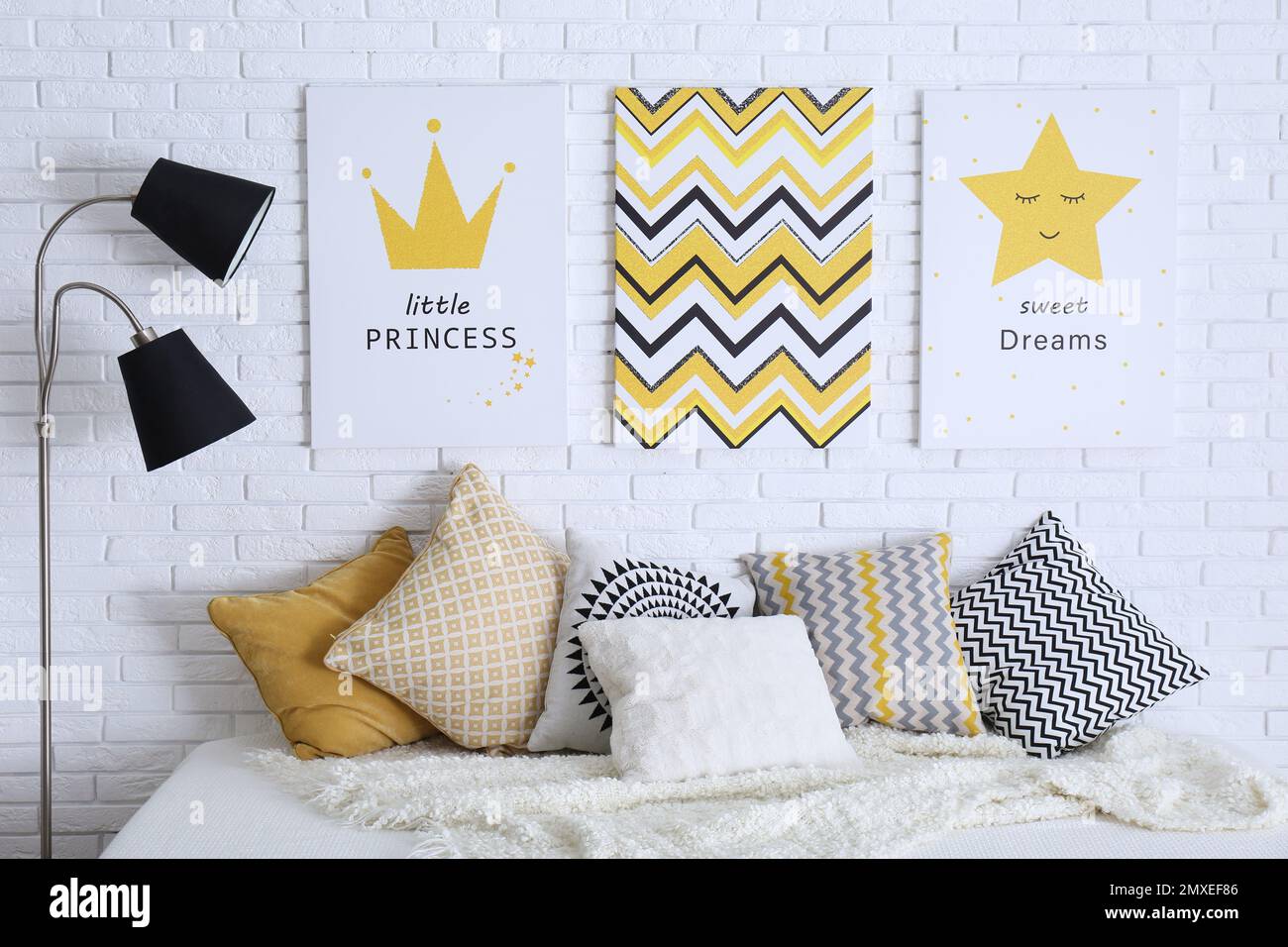 Child's room interior with bed and cute posters on wall Stock Photo - Alamy