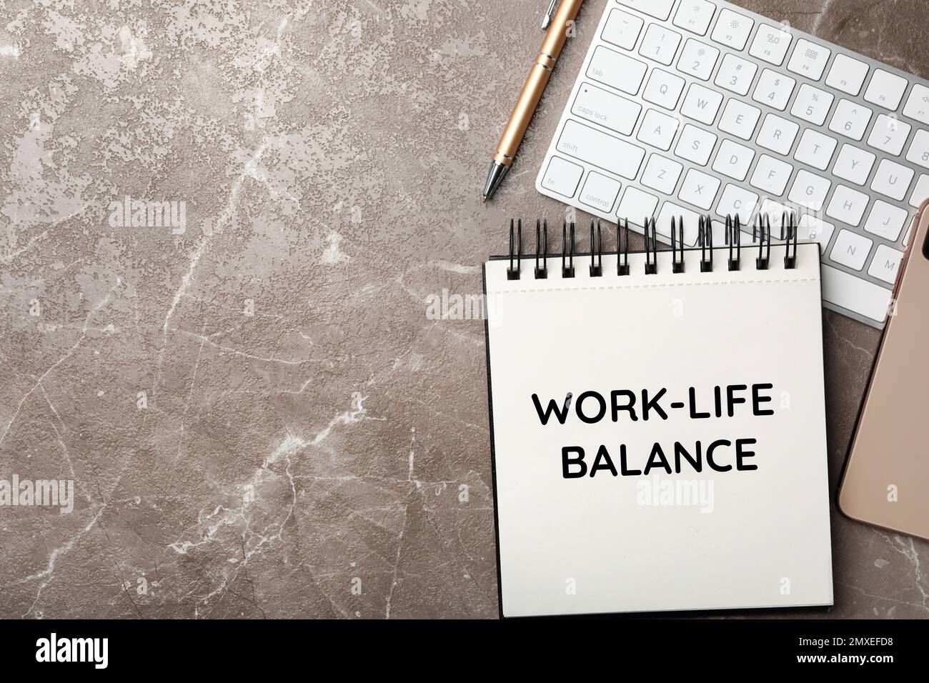 Work-life balance concept. Notebook and keyboard on grey marble table ...