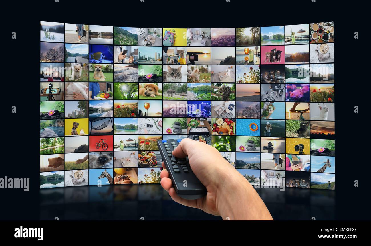 Streaming video services. Man using remote control to change channels