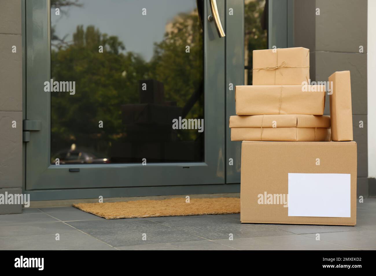 Cardboard boxes near door. Parcel delivery service Stock Photo Alamy