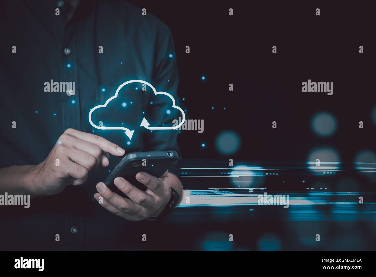 Businessman holding smartphone technology digital with cloud computing icon.Business Cloud computing concept . Stock Photo