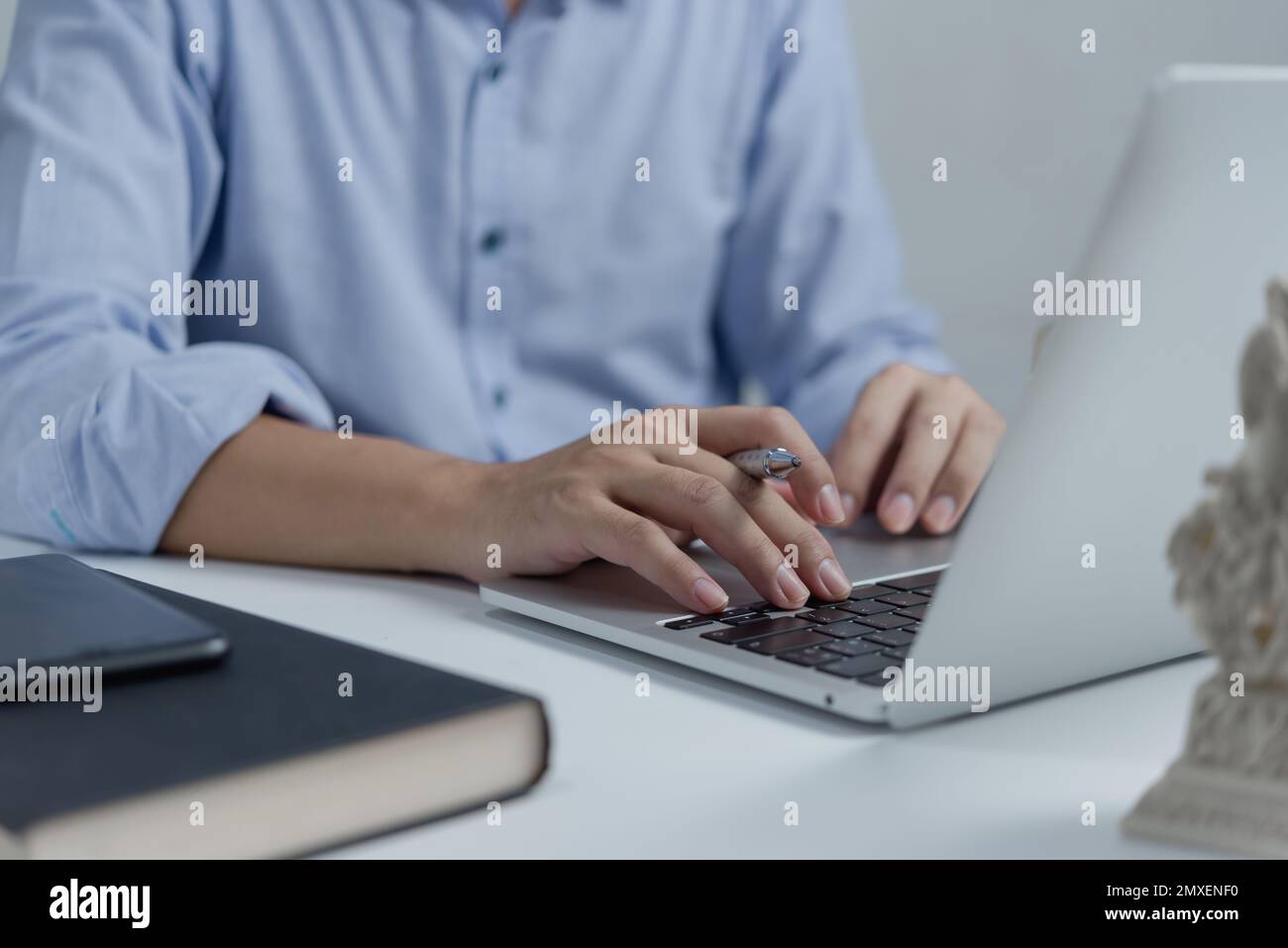 Businessperson hands working and typing on laptop keyboard on table. Stock Photo