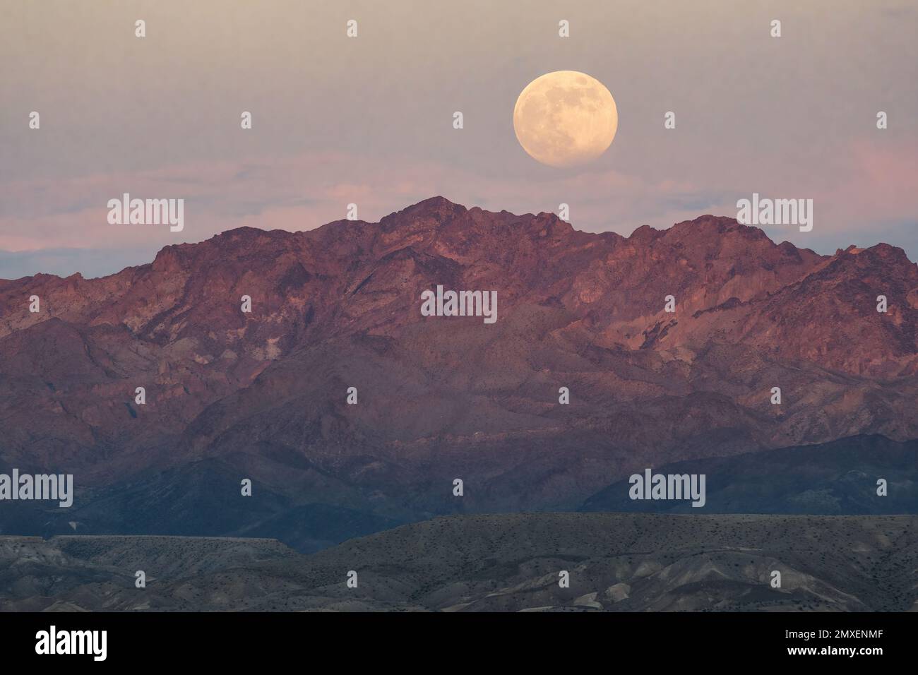 The wolf moon rising above lake Mead Stock Photo Alamy
