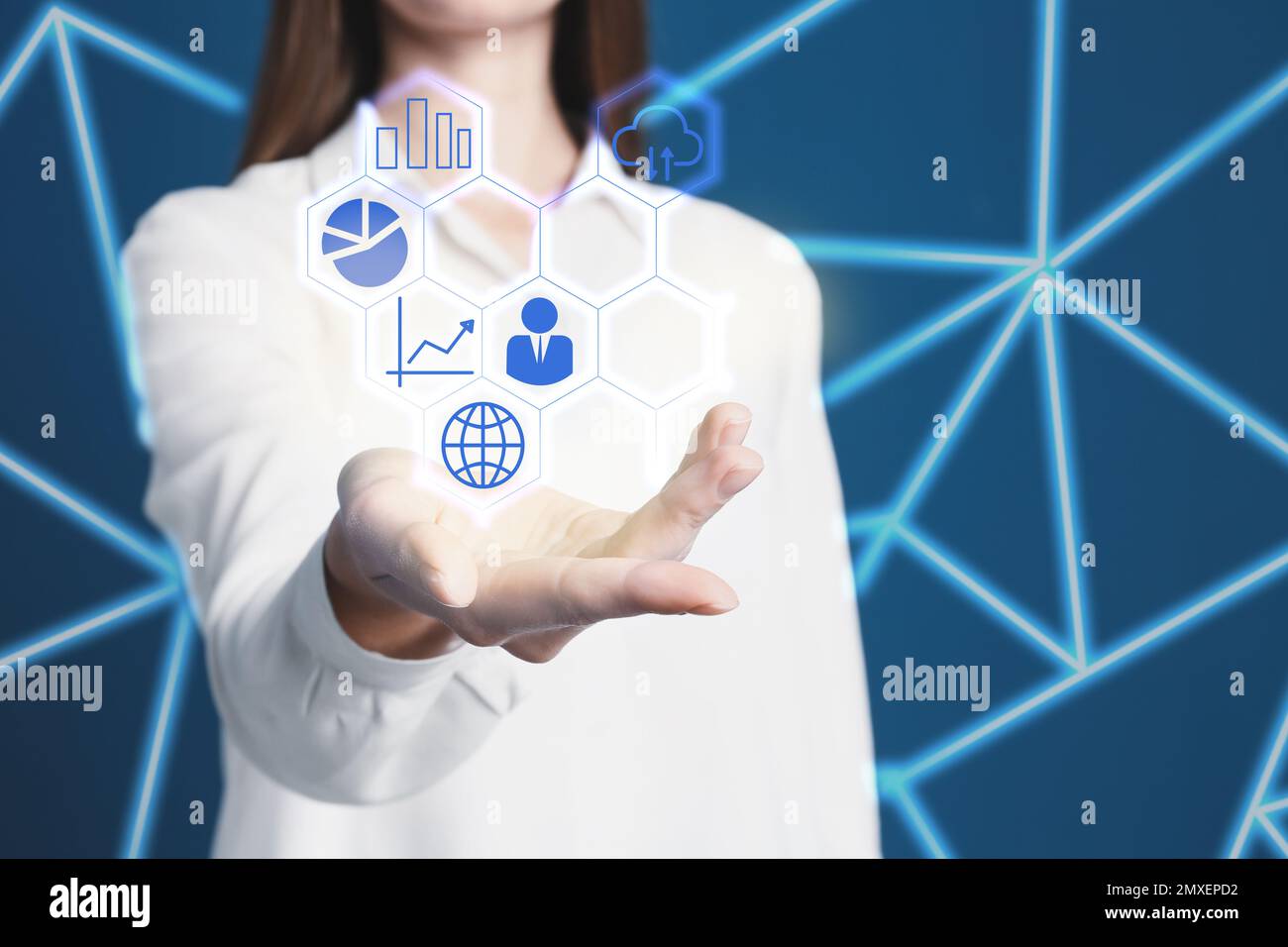 Woman demonstrating icons of data management system on blue background ...