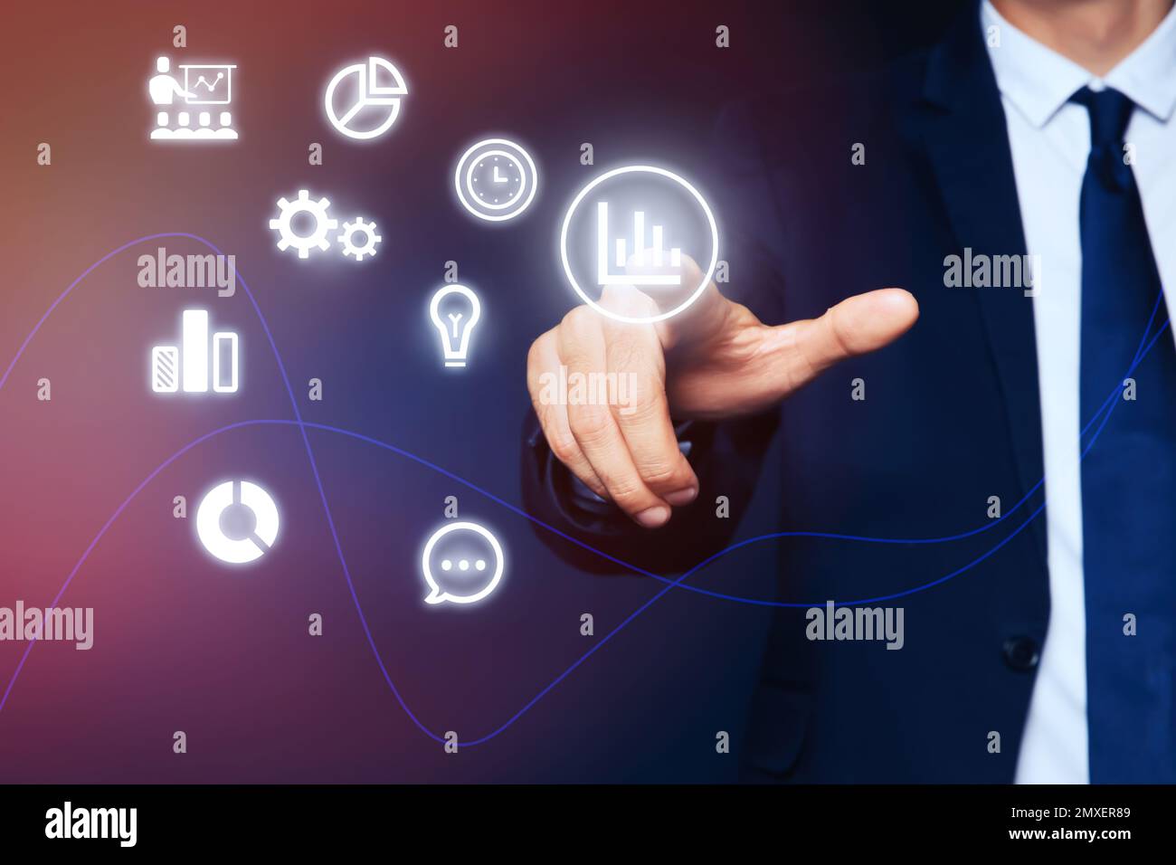 Core values concept. Businessman pointing at icon on virtual screen Stock Photo
