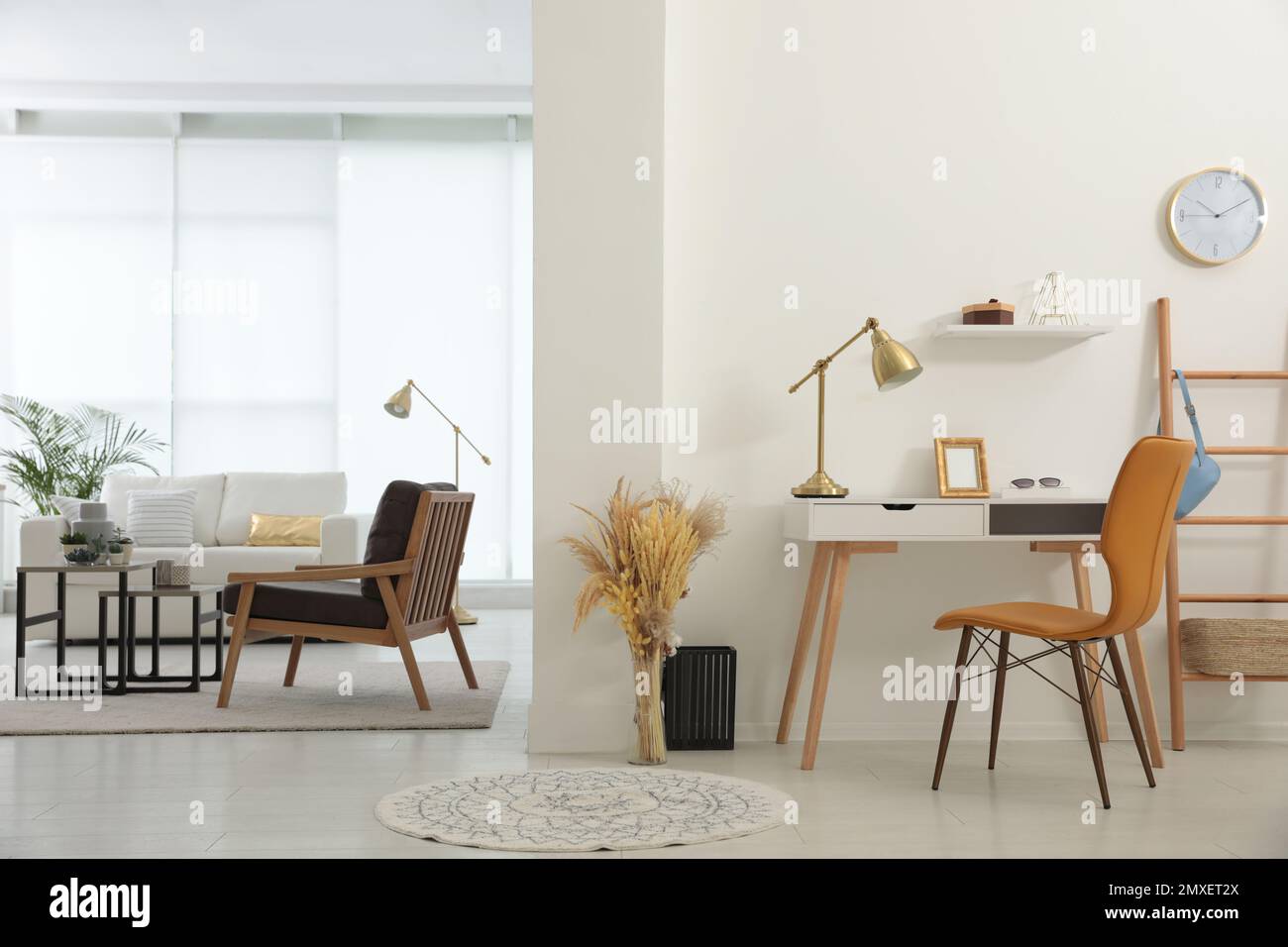 Living room and workplace in spacious apartment. Interior design Stock ...