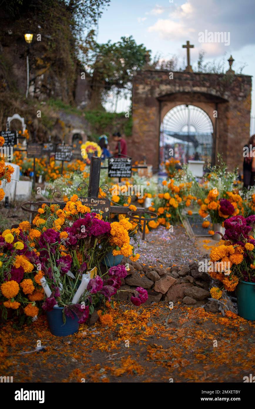 A vertical shot of a cemetery during the Day of the Dead in Michoacan, Mexico. Stock Photo