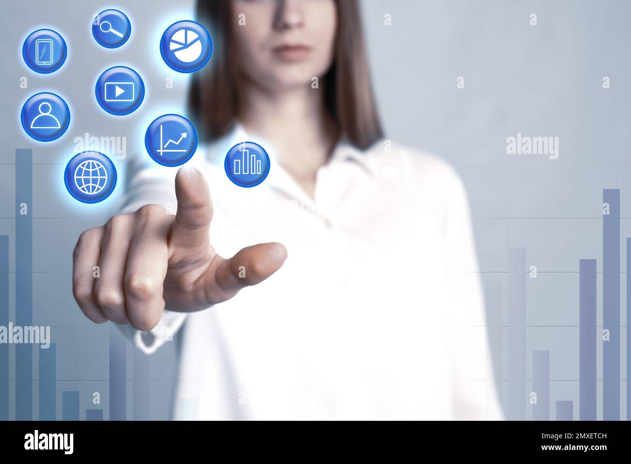 Data management system. Woman pointing at virtual icon on grey background  Stock Photo - Alamy