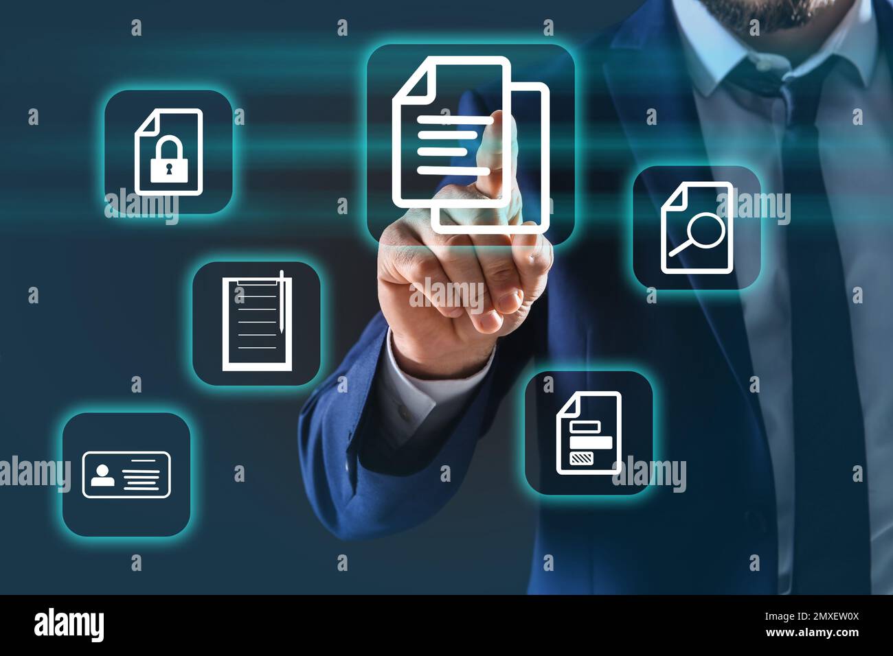 Man pointing at document icon on virtual screen, closeup Stock Photo