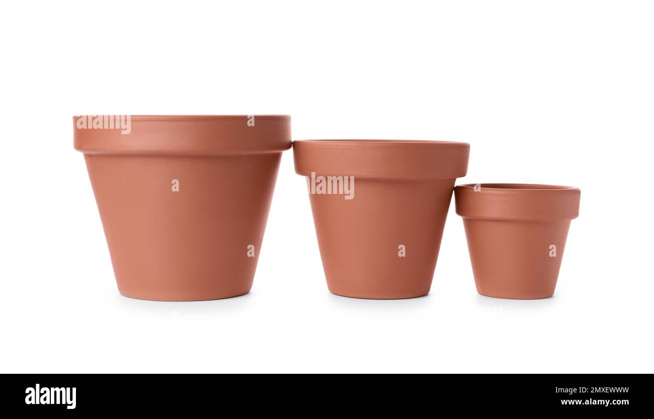 Stylish terracotta flower pots isolated on white Stock Photo Alamy