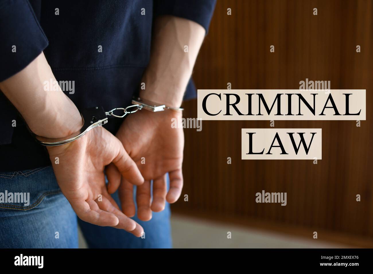 Man detained in handcuffs indoors. Criminal law concept Stock Photo Alamy
