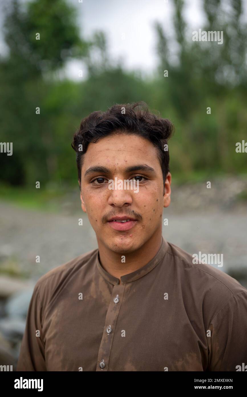 Portrait of a young Pashtun man with moustache, Swat Valley, Pakistan Stock Photo