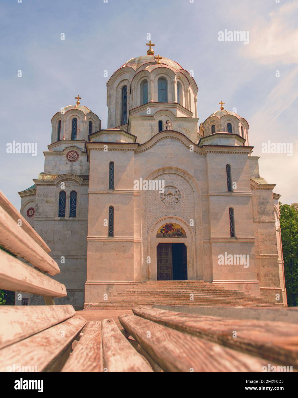 A low angle shot of Holy Martyr George church on a sunny day in Topola, Serbia Stock Photo