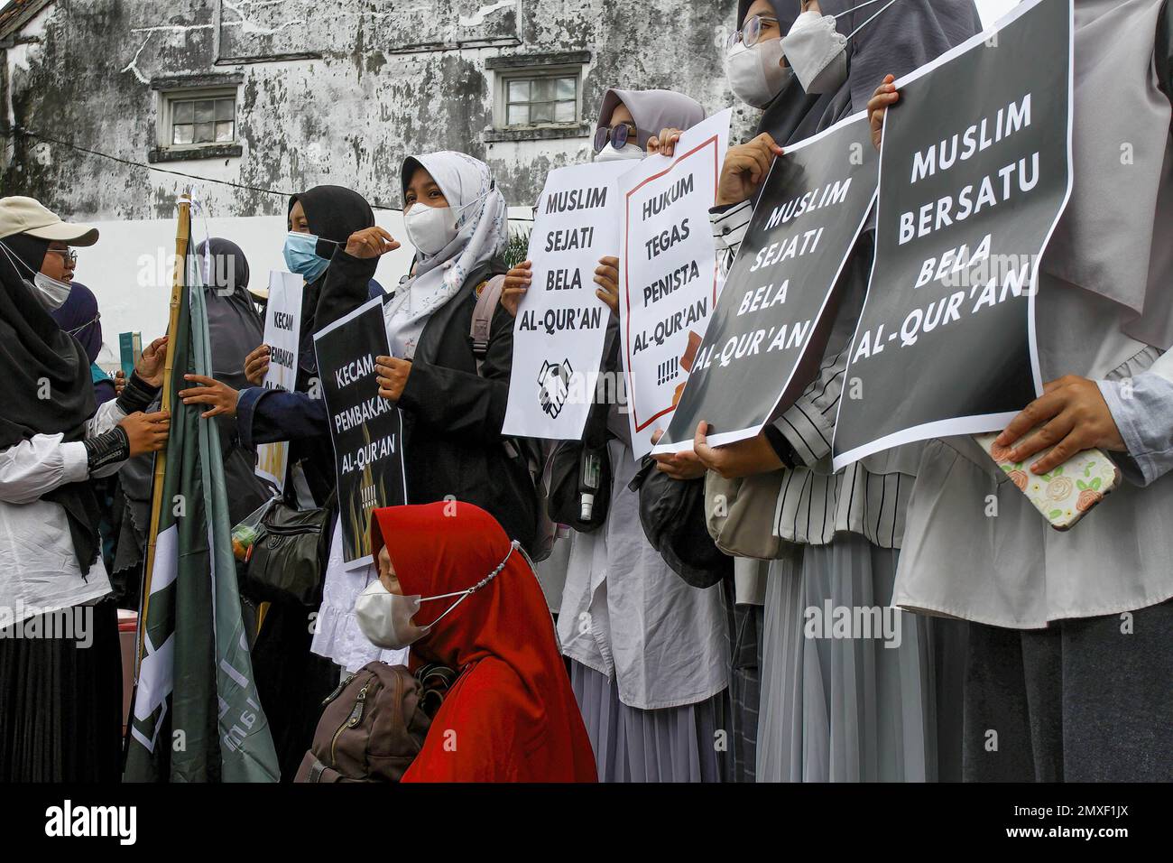 Yogyakarta, Indonesia. 03rd Feb, 2023. Indonesian Muslims hold placards expressing their opinion during the demonstration. The demonstrations were held in protest against the burning of the Quran by Swedish-Danish right-wing politician Rasmus Paludan, in Sweden, and the tearing of pages of the Quran by Edwin Wagensveld, leader of the Dutch anti-Islam group Pegida, in The Hague. Credit: SOPA Images Limited/Alamy Live News Stock Photo