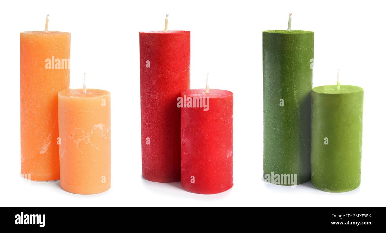 Pillar wax candle burning on white background Stock Photo - Alamy