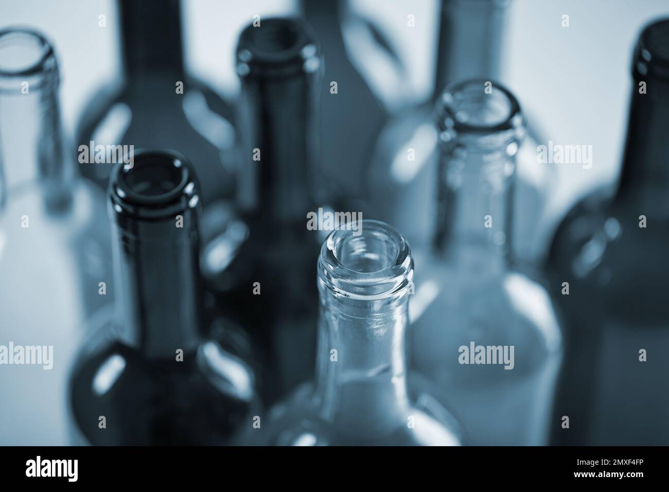 several wine bottles in blue color Stock Photo