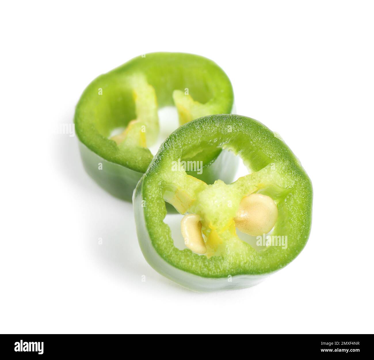 Cut green hot chili pepper on white background Stock Photo - Alamy