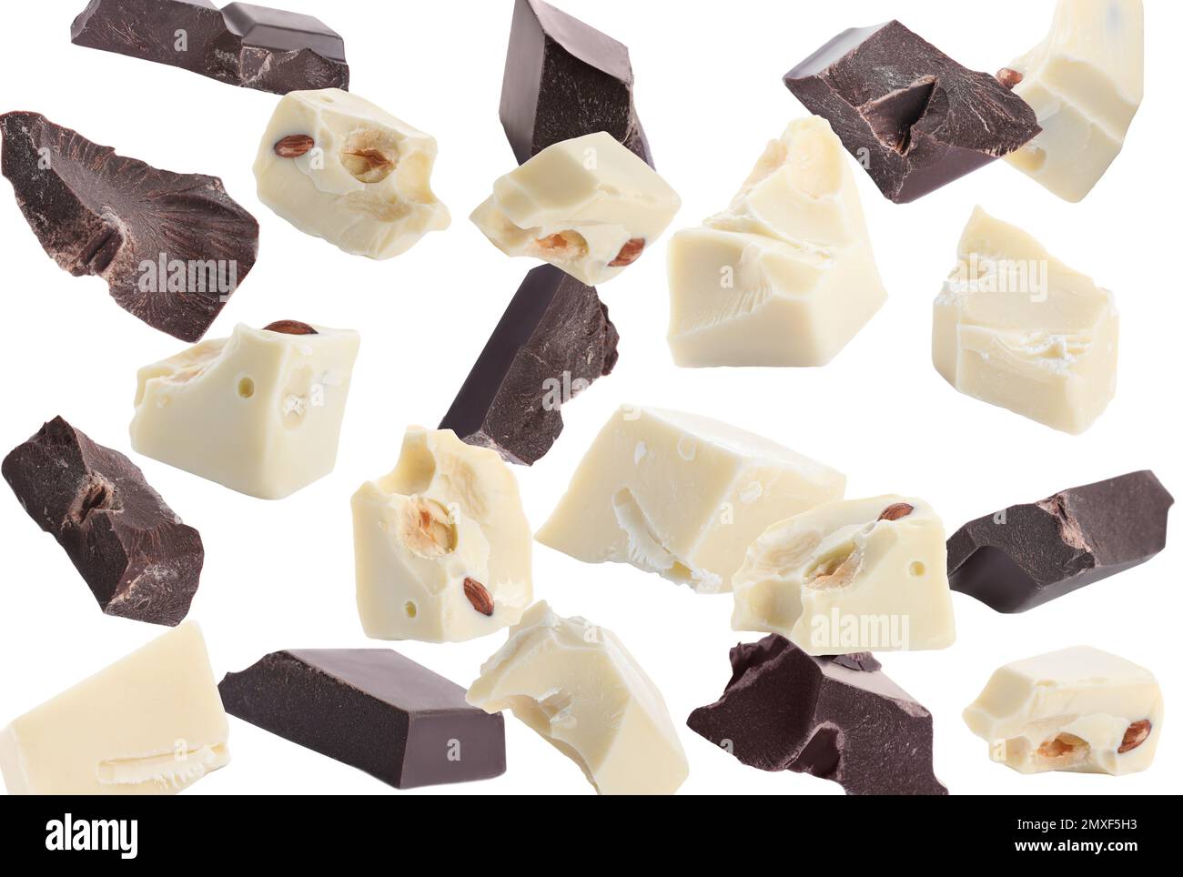 Delicious chocolate chunks falling on white background Stock Photo