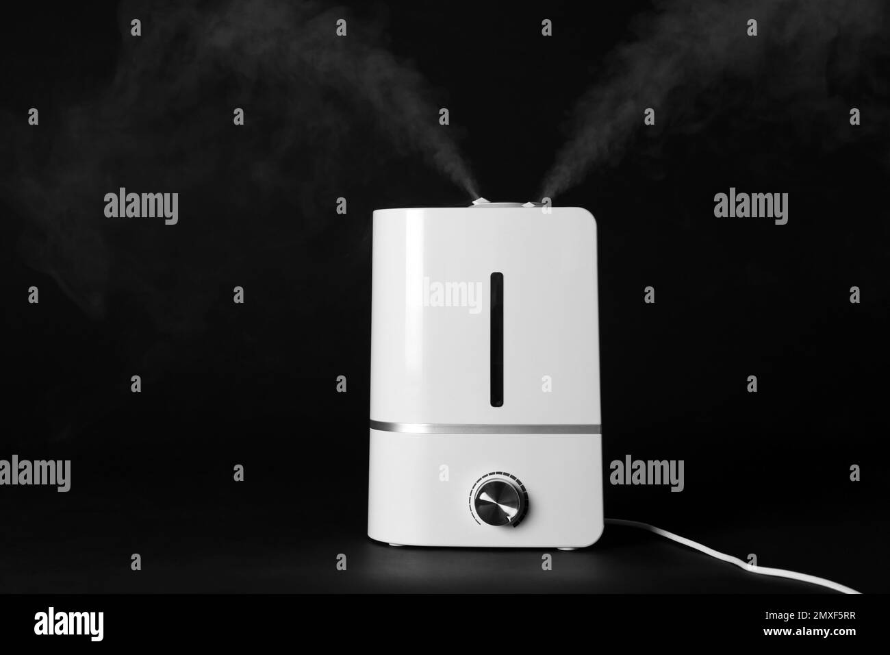 New modern air humidifier on black background Stock Photo