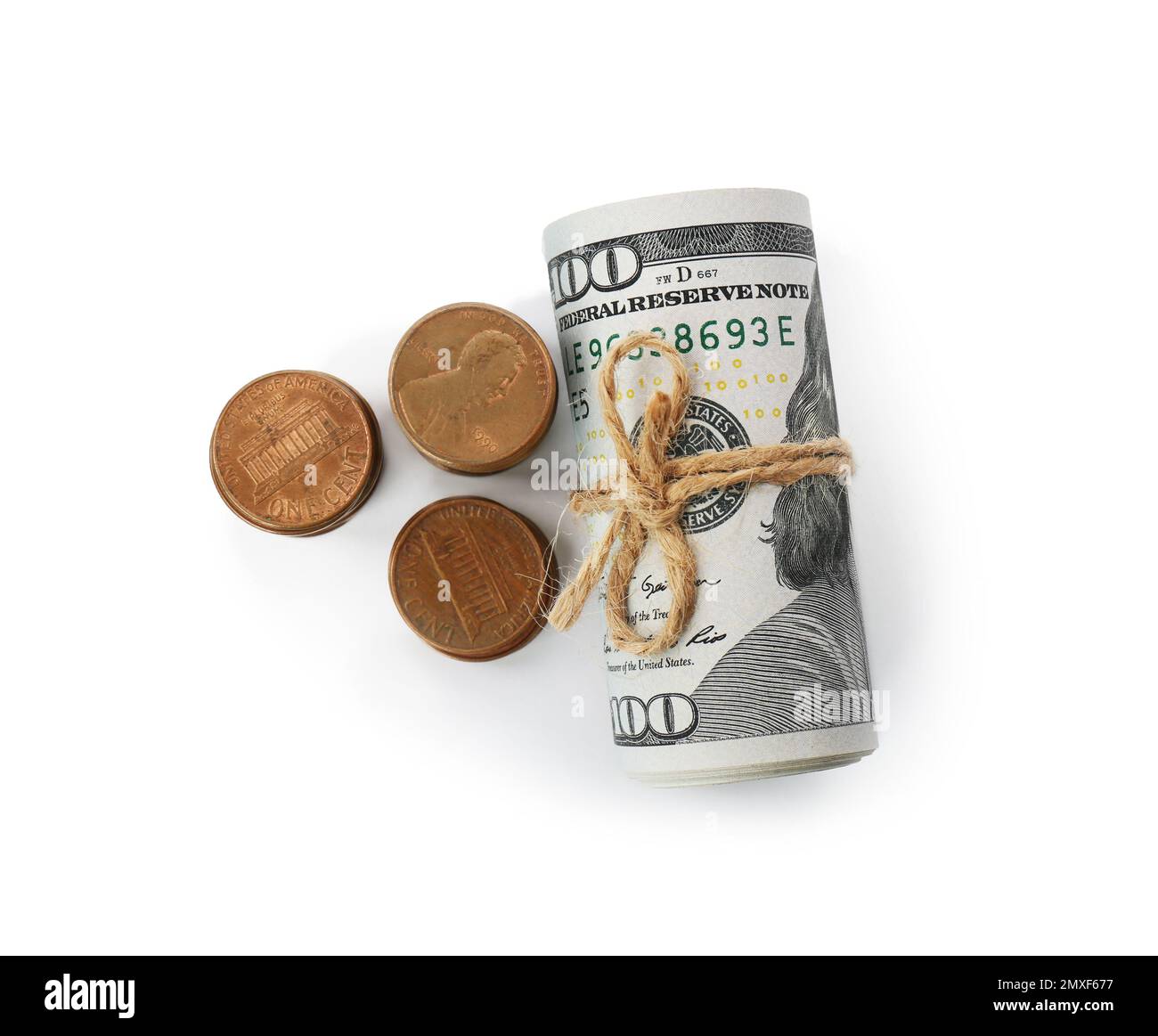 Roll of dollar bills tied with rope and coins isolated on white, top ...