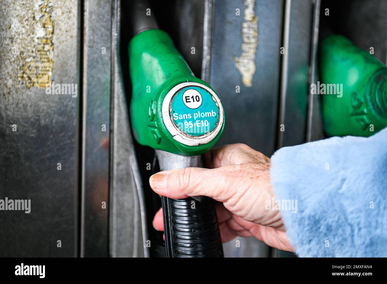 Sp95 Gas Illustration picture shows a person using a petrol pump (unleaded fuel ...