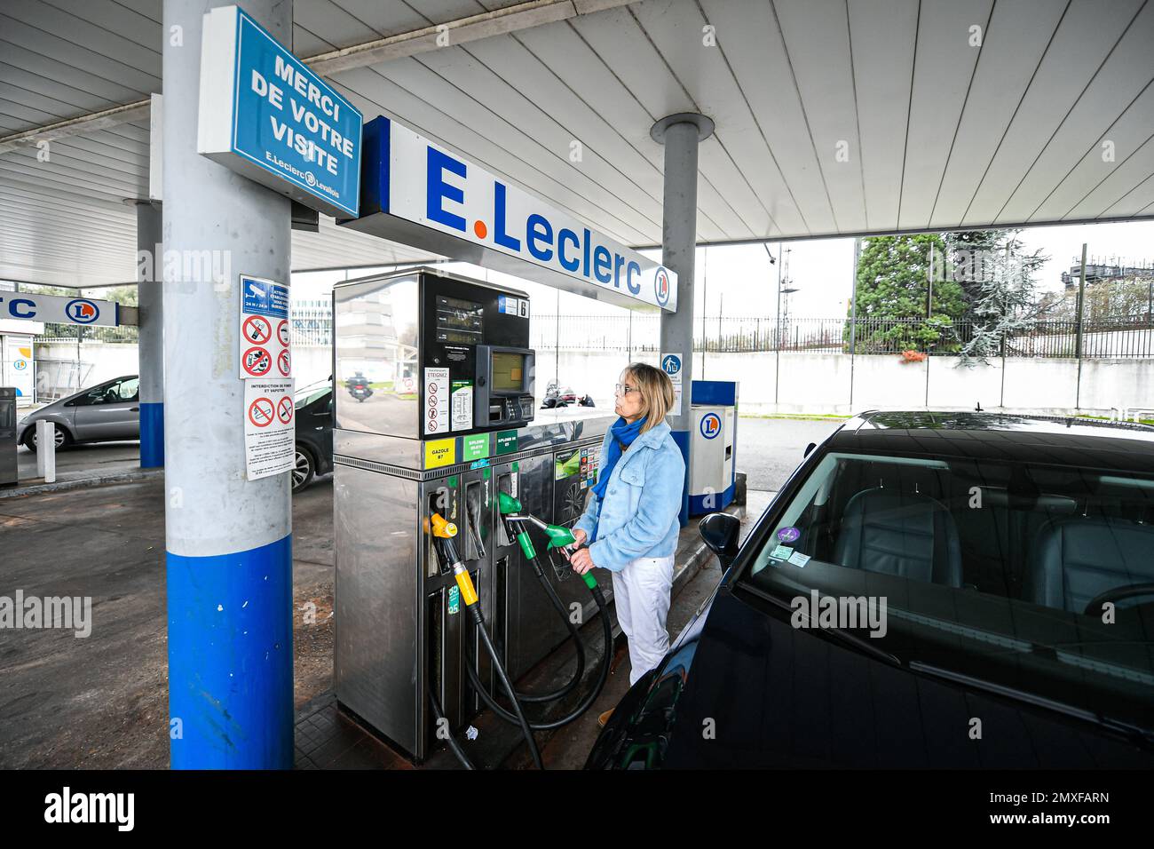 Sp95 Gas Illustration picture shows a person using a petrol pump (unleaded fuel ...