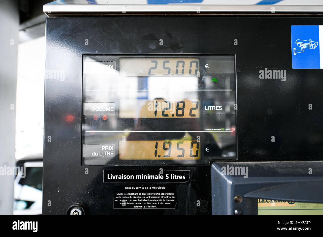 Sp95 Gas Illustration picture shows the price after a person using a petrol pump ...