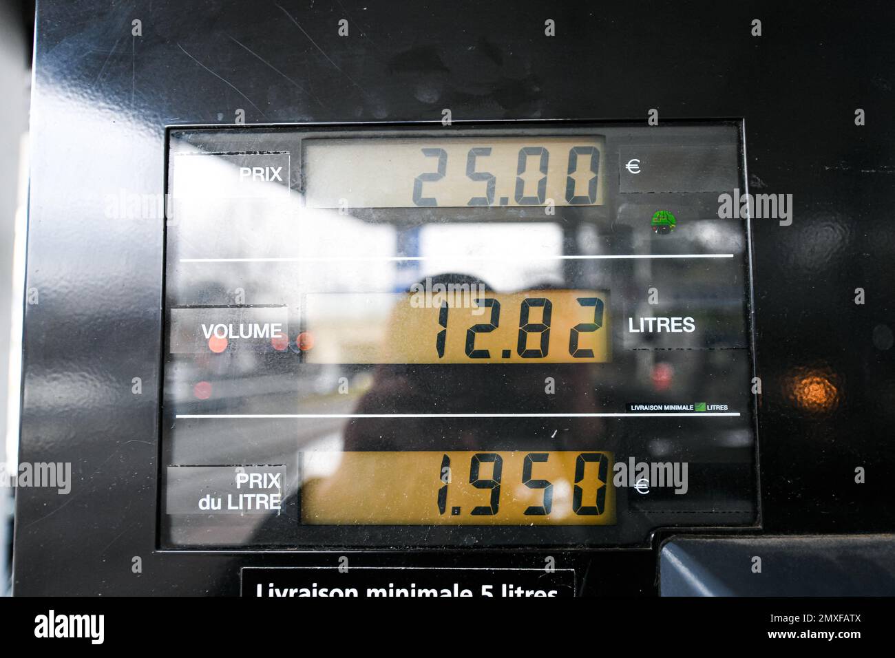 Sp95 Gas Illustration picture shows the price after a person using a petrol pump ...