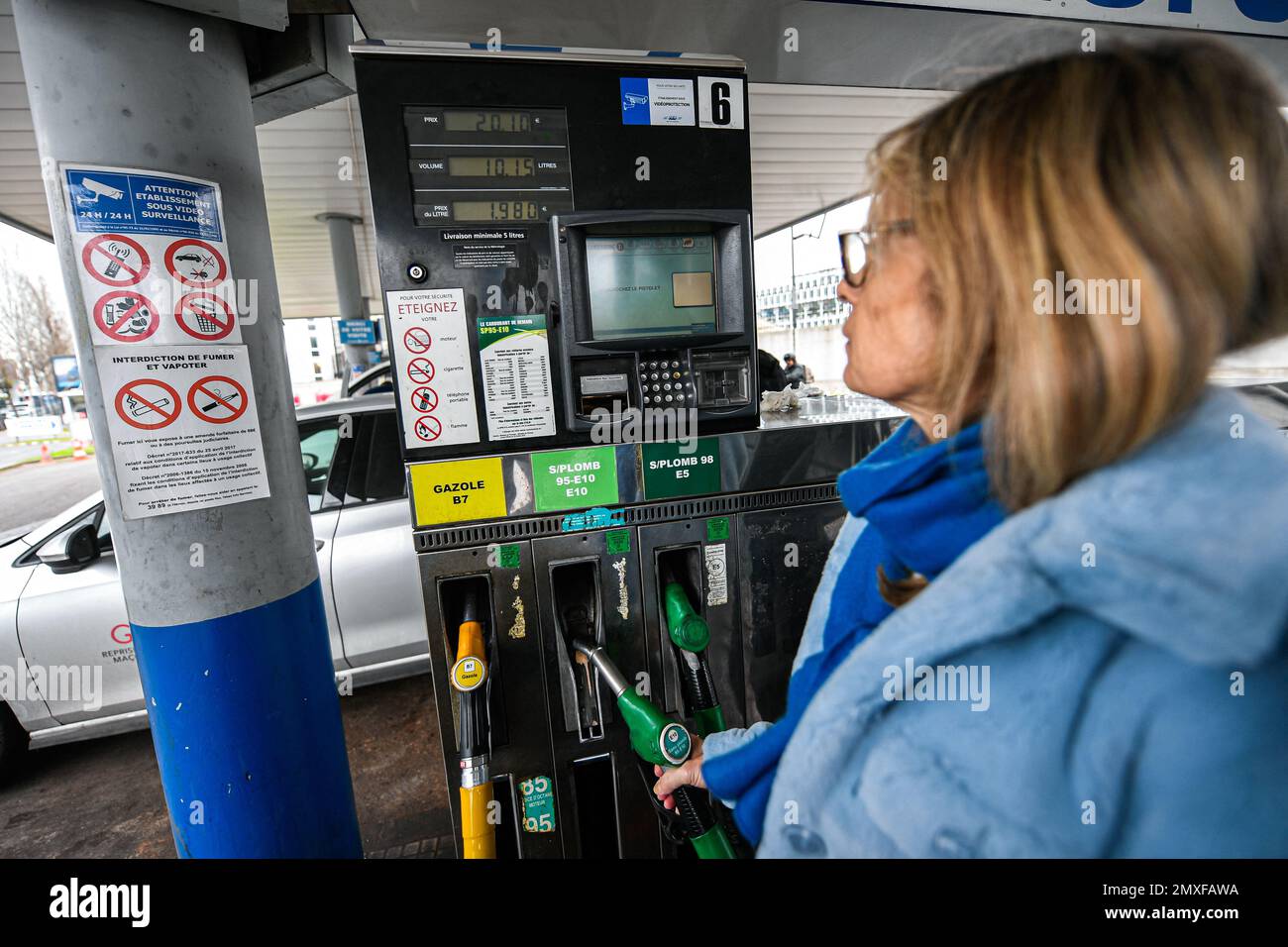 Sp95 Gas Illustration picture shows a person using a petrol pump (unleaded fuel ...