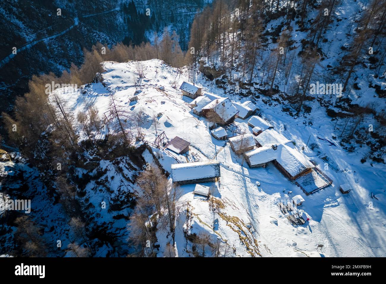 Aerial view of the Pastore Refuge at dawn in winter. Alpe Pile, Alagna, Valsesia, Alagna, Valsesia, Vercelli province, Piedmont, Italy, Europe. Stock Photo